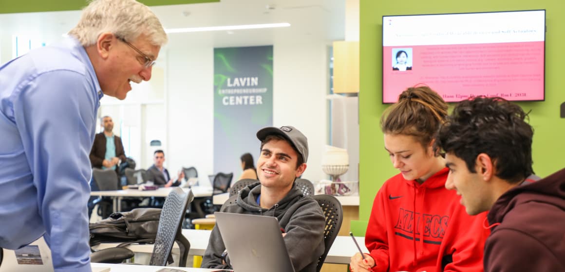 Students talking to instructor