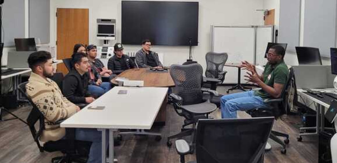 Students talking to instructor